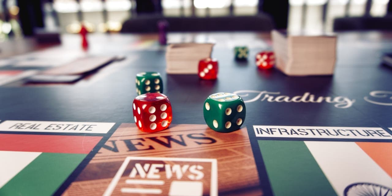 Custom red and green dice with NEWS cards and game board
